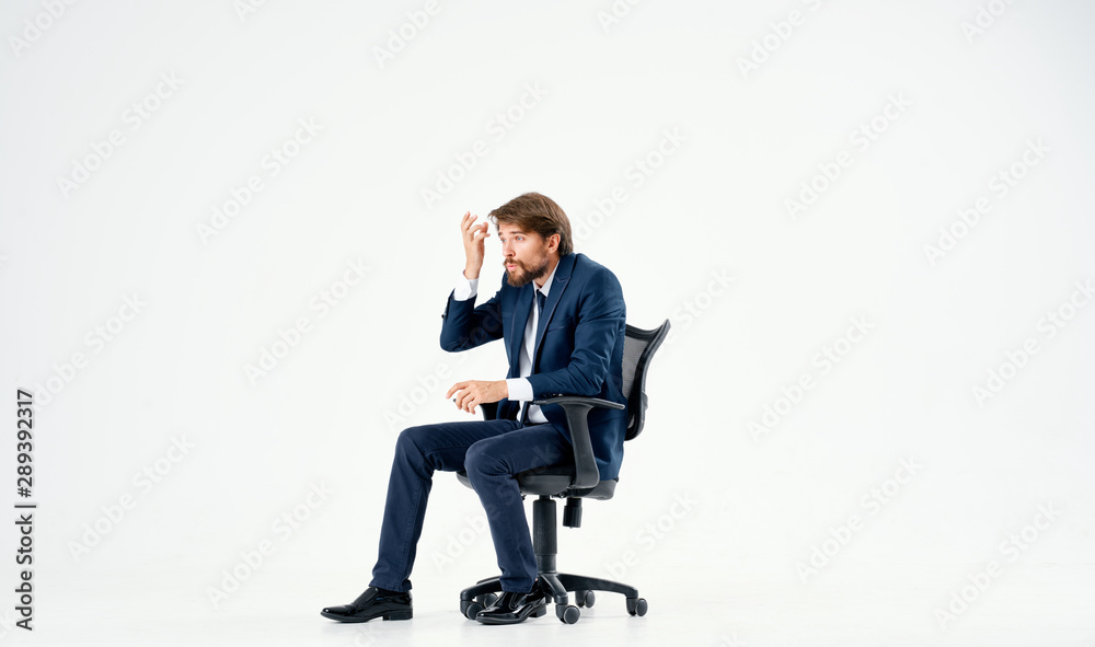 businessman sitting on office chair with laptop businessman sitting on office chair with laptop