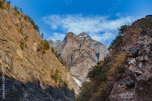 Himalayan mountain partly covered with snow in bright sunny summer day.  © valdisskudre