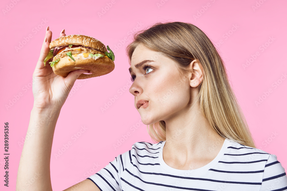 woman eating hamburger