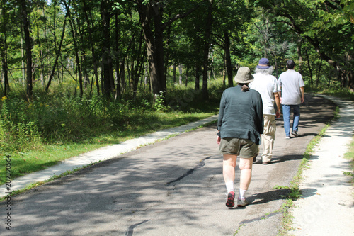 Three older people walking on the North Branch Trail at Miami Woods in Morton Grove photo