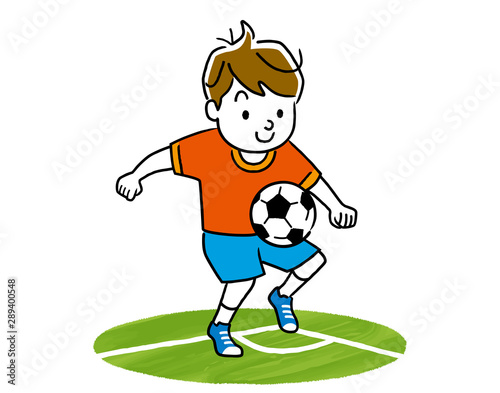 Boy playing with a soccer ball