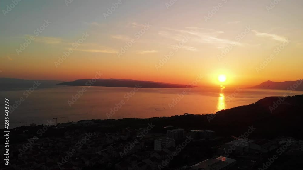 Aerial pan over the town of Makarsa during golden hours revealing the wonderful sunset Aerial pan over the town of Makarsa during golden hours revealing the wonderful sunset