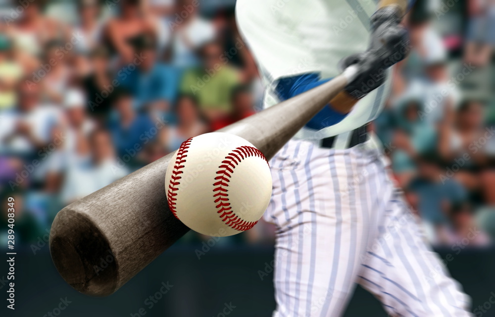 Baseball player hitting ball with bat in close up Stock Photo | Adobe Stock