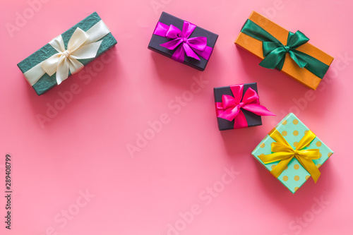 frame from boxes with presents on pink background top view mockup