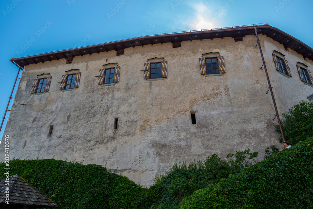 Bled, Slovenia - August 15, 2019: Walls of an old castle on the shore of Lake Bled in Slovenia against the sky