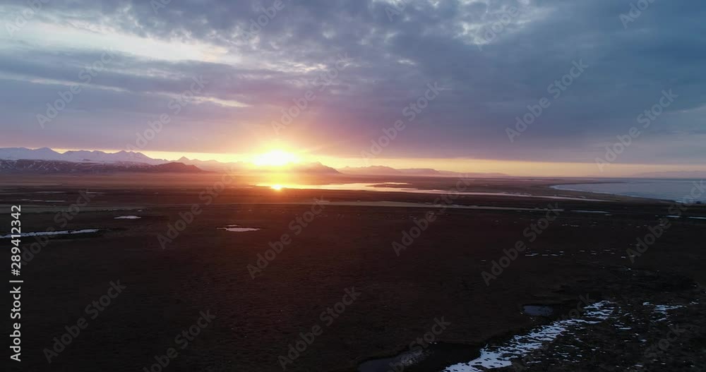 Drone flight at sunrise/sunset at lne iceland view ocean and mountains Drone flight at sunrise/sunset at lne iceland view ocean and mountains