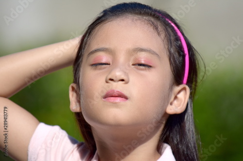 A Worried Cute Filipina Child