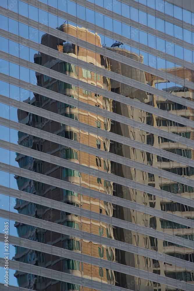 Fototapeta premium Distorted building reflection from facade window