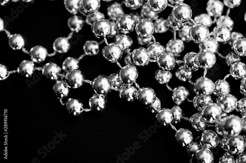 Christmas decoration on a dark surface close up black and white. Abstract background