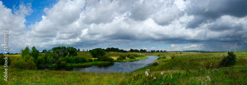 landscape with river and cloudy sky