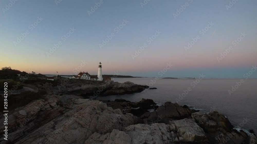 Cinematic aerial video of rocky New England coastline and picturesque lighthouse Cinematic aerial video of rocky New England coastline and picturesque lighthouse