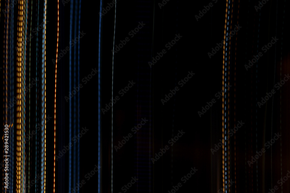 graphic design lines long exposure of lights creating straight, wavy and dotted colorful lines pattern