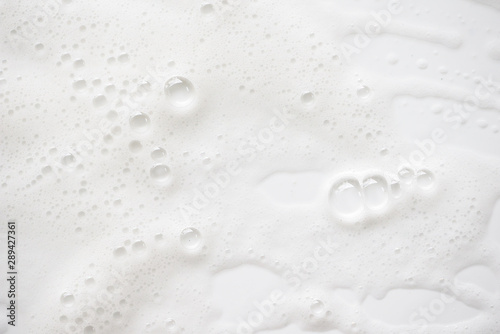 Abstract background white soapy foam texture. Shampoo foam with bubbles