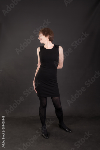 slim woman in a black dress