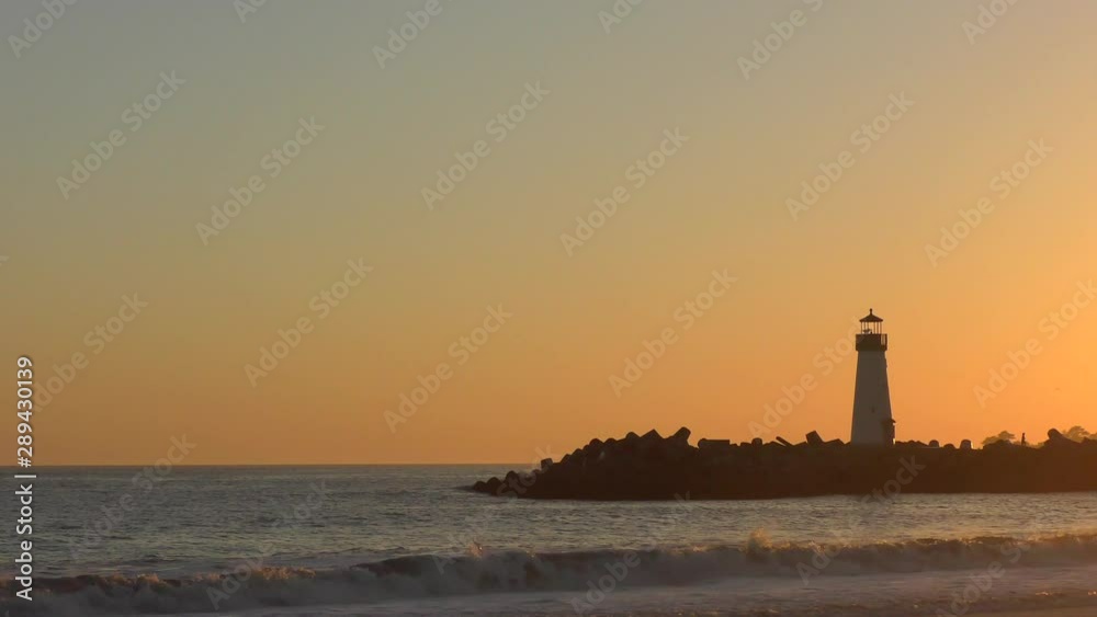 The Pacific Ocean at the Santa Cruz Breakwater (aka Walton) Lighthouse at sunset, in Santa Cruz, California, USA The Pacific Ocean at the Santa Cruz Breakwater (aka Walton) Lighthouse at sunset, in Santa Cruz, California, USA