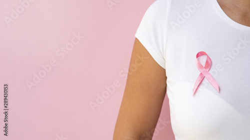 Wallpaper Mural Close-up person with pink ribbon Torontodigital.ca