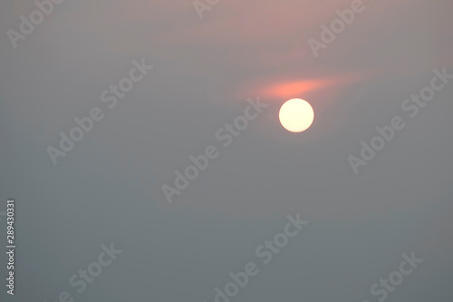 Sunrise sky covered with haze   making it look unusual