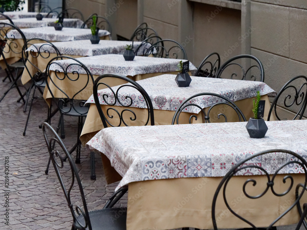Sarnico, ITALY. street cafe tables stand on the pavement