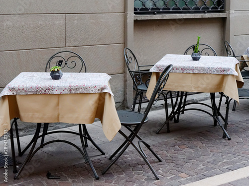 Sarnico, ITALY. street cafe tables stand on the pavement photo