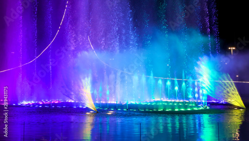 A dancing fountain of blue in the park