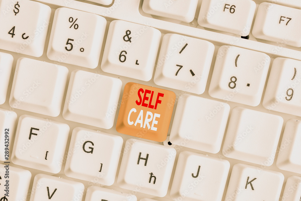 Writing note showing Self Care. Business concept for the practice of taking action to improve one s is own health White pc keyboard with note paper above the white background Writing note showing Self Care. Business concept for the practice of taking action to improve one s is own health White pc keyboard with note paper above the white background