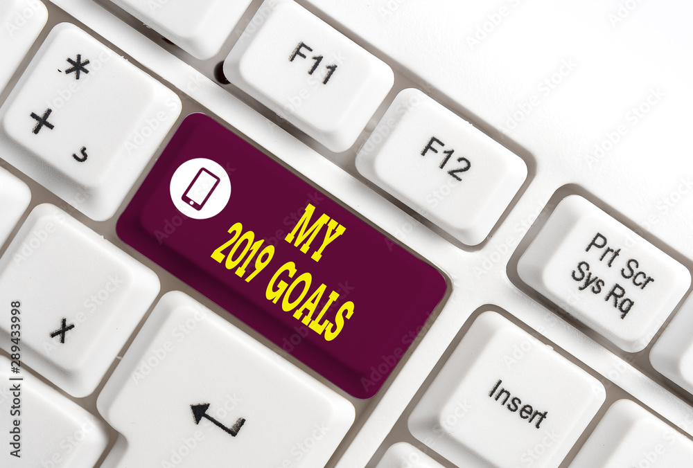 Writing note showing My 2019 Goals. Business concept for setting up demonstratingal goals or plans for the current year White pc keyboard with note paper above the white background Writing note showing My 2019 Goals. Business concept for setting up demonstratingal goals or plans for the current year White pc keyboard with note paper above the white background