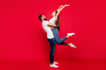 Full length body size view of his he her she nice attractive lovely cheerful cheery free careless spouses spending day dream free spare time having fun isolated over bright vivid shine red background