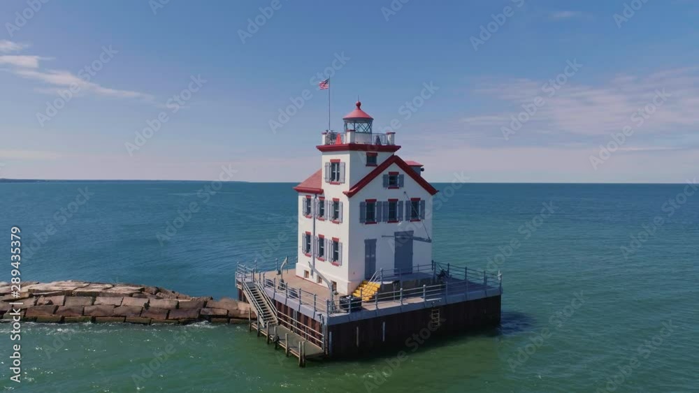 Lake Erie lighthouse on sunny Summer day (drone rising orbit shot) Lake Erie lighthouse on sunny Summer day (drone rising orbit shot)