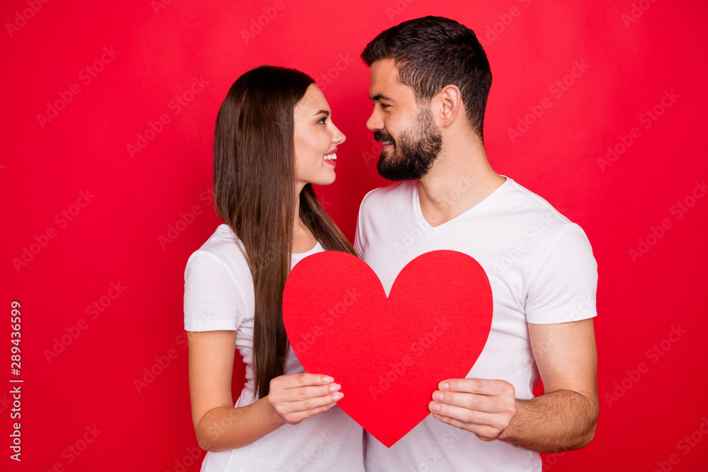 Photo of cute nice casual charming lovely stylish trendy couple of two people together rejoicing weekend wearing white t-shirt while isolated with red background