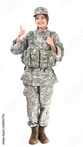 Young female soldier showing thumb-up on white background