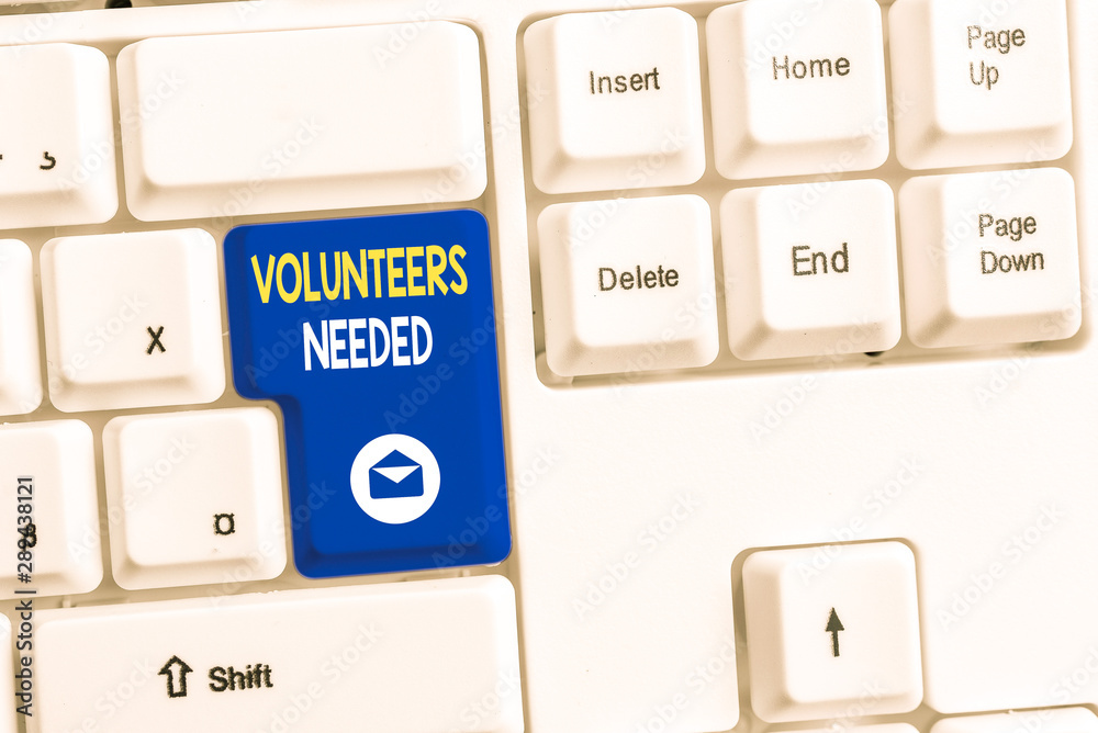 Word writing text Volunteers Needed. Business photo showcasing need work or help for organization without being paid White pc keyboard with empty note paper above white background key copy space