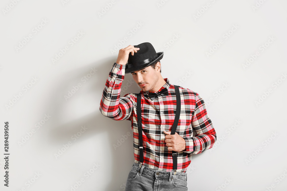 Stylish fashionable man on light background Stylish fashionable man on light background
