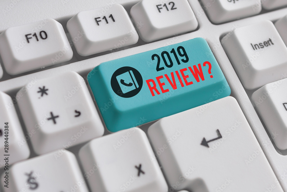 Writing note showing 2019 Review Question. Business concept for remembering past year events main actions or good shows White pc keyboard with note paper above the white background Writing note showing 2019 Review Question. Business concept for remembering past year events main actions or good shows White pc keyboard with note paper above the white background
