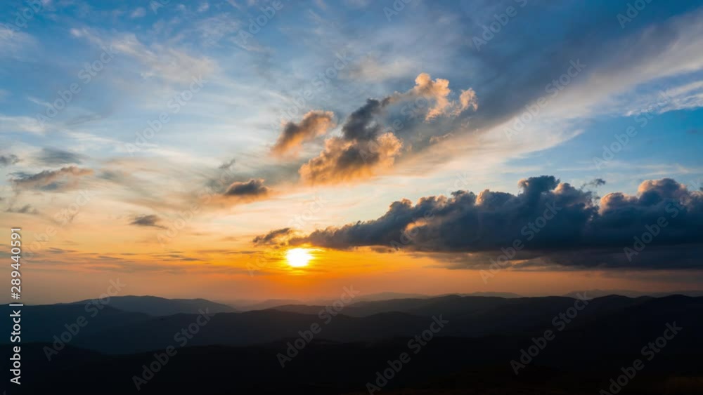 Time Lapse at Sunset Landscape in the Mountains. Clouds moving in the Sky. Sun Moving Down over Mountain Range Time Lapse at Sunset Landscape in the Mountains. Clouds moving in the Sky. Sun Moving Down over Mountain Range