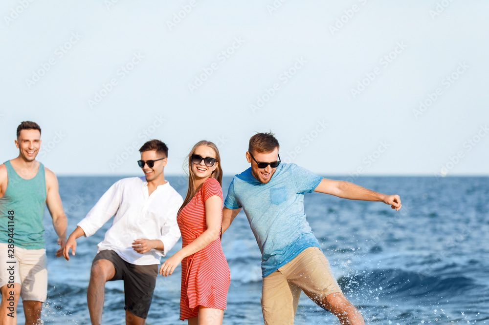 Happy friends on sea beach at resort Happy friends on sea beach at resort
