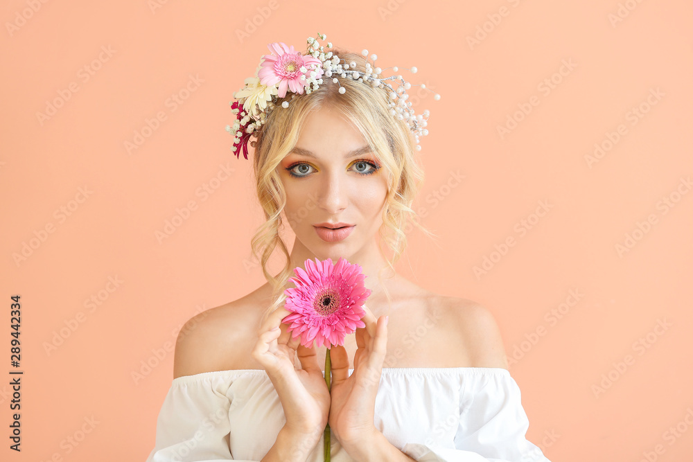 Beautiful young woman with flower wreath on color background Beautiful young woman with flower wreath on color background