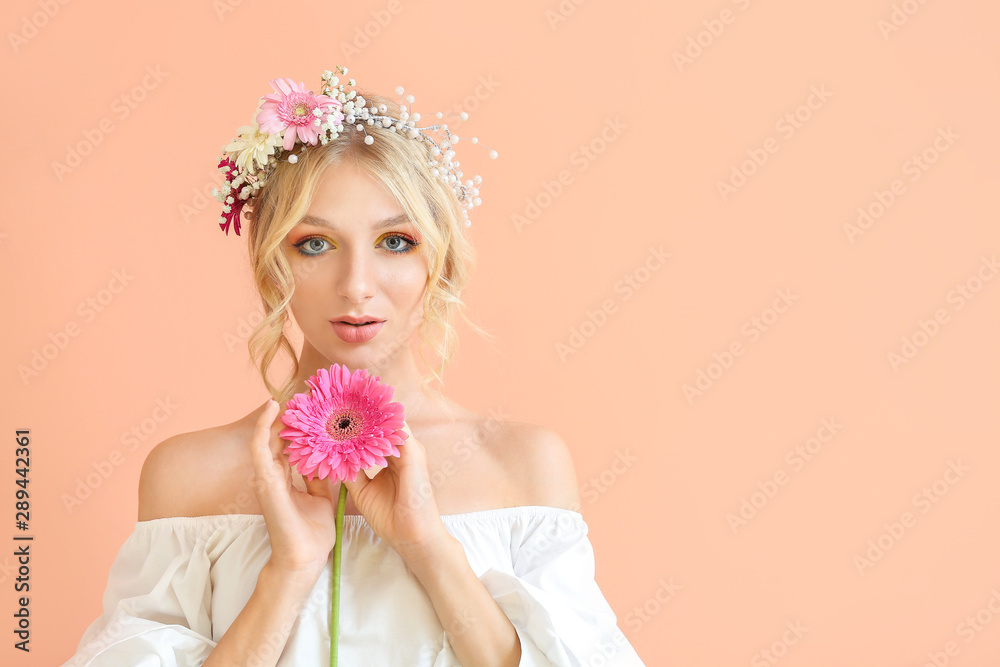 Beautiful young woman with flower wreath on color background Beautiful young woman with flower wreath on color background