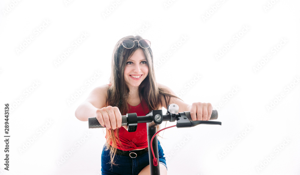 Girl driving an electric scooter with a speed face. Girl driving an electric scooter with a speed face.