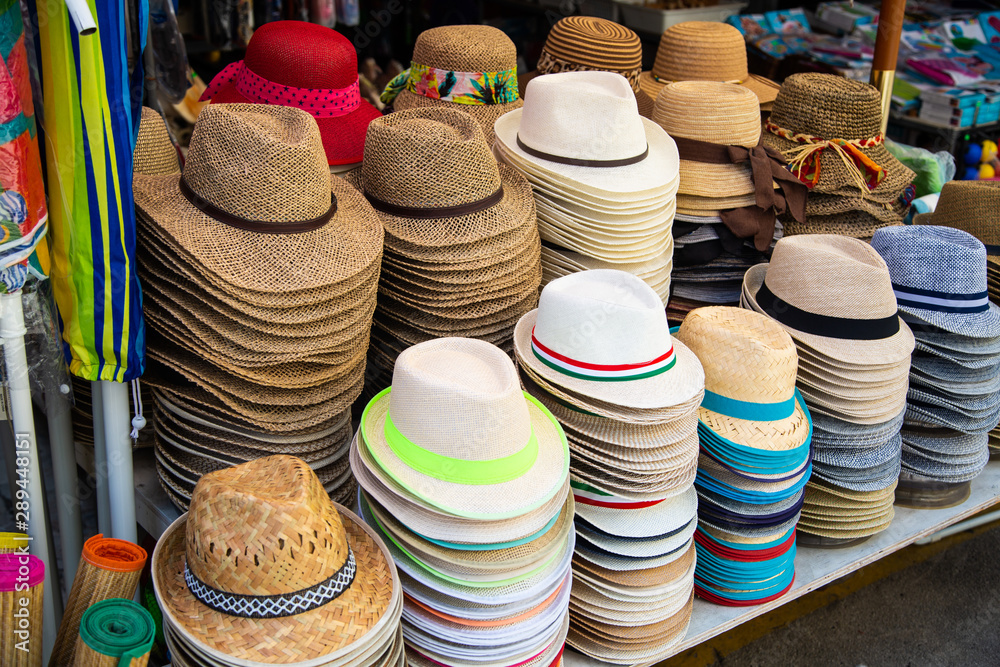Hats in front of a shop in Italy, colorful straw hats
