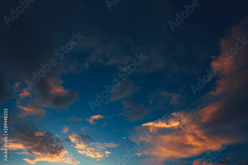 Evening sky, orange clouds and blue sky