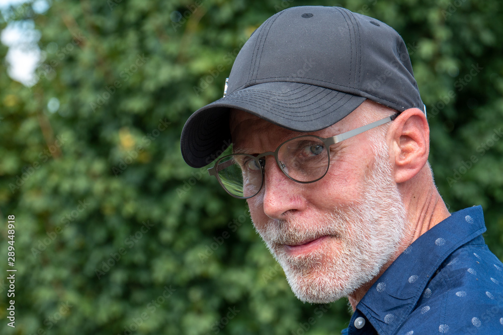 portrait of senior man with beard and glasses portrait of senior man with beard and glasses