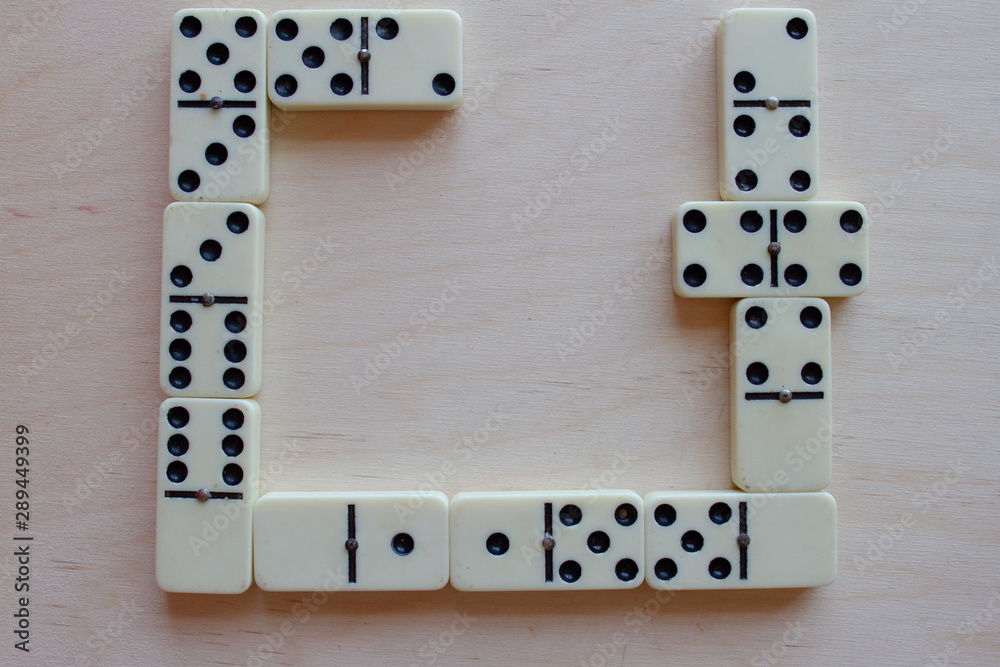 falling dominoes. domino effect. the domino game. Stock Photo | Adobe Stock