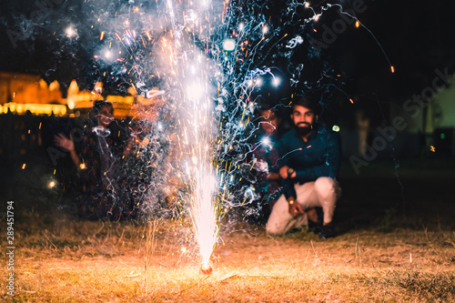 People watching fireworks and celebrating Indian Festival Diwali.  photo