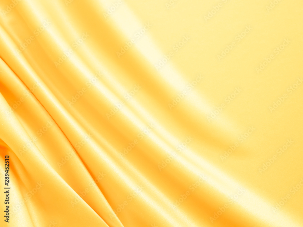 Beautiful smooth elegant wavy light yellow satin silk luxury cloth fabric texture, abstract background design. Copy space. Beautiful smooth elegant wavy light yellow satin silk luxury cloth fabric texture, abstract background design. Copy space.
