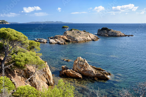Estagnol tiny island visible from the coastal hiking trail in Bormes-les-Mimosas, France. A typical mediterranean seascape.