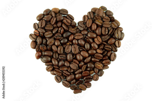 Heart shaped roasted coffee beans isolated white background.