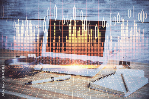 Multi exposure of chart and financial info and work space with computer background. Concept of international online trading. © peshkova