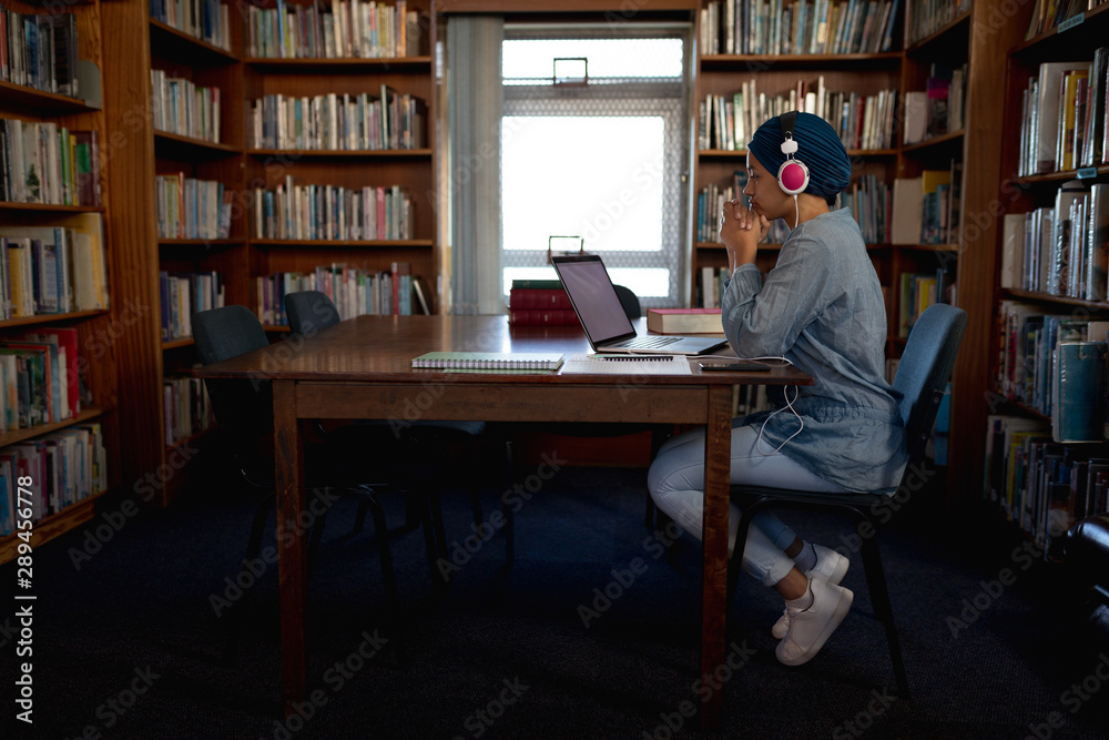 Young woman studying in library Young woman studying in library