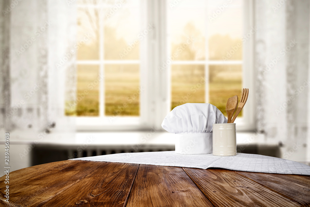 Blurred background of window and wooden table of free space for your decoration Blurred background of window and wooden table of free space for your decoration