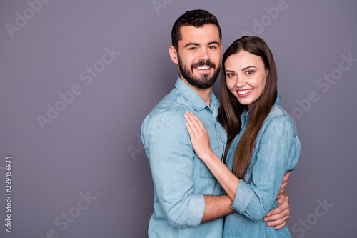 Close-up portrait of two her she his he nice attractive charming lovely careful sweet tender lovable cheerful cheery person embracing isolated over gray violet purple pastel background